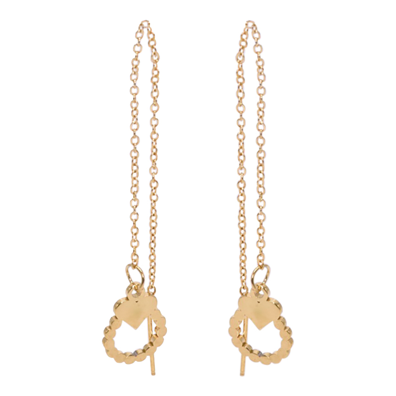 Earrings in steel, gold colored with a heart and an open circle